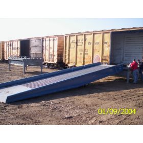 The Railcar Loading Ramp is portable for loading and unloading rail cars.